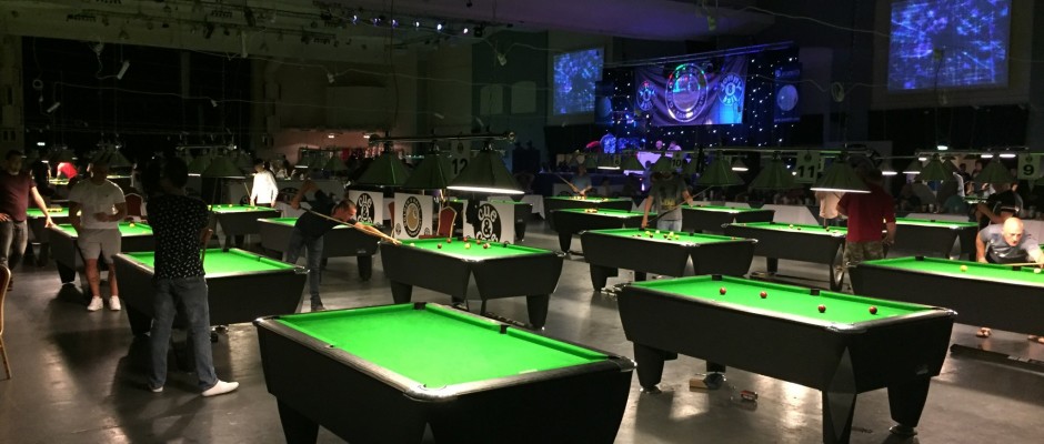 The arena today, tables laid out across the exhibition hall